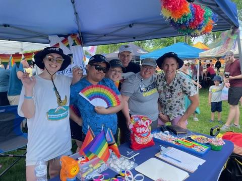 Group of 易胜博 instructors and students wearing rainbows at the Rochester PRIDE event.